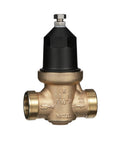 Front view of brass NR3XL 1-1/4 in pressure reducing valve with double union FNPT connections and black cap.