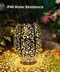 Fairy Solar Lights Outdoor Garden Decor Bucket Type 2 Pack Waterproof Lanterns glowing at night in rain showing IP44 resistance.