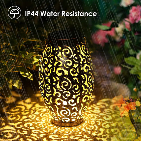 Fairy Solar Lights Outdoor Garden Decor Bucket Type 2 Pack Waterproof Lanterns glowing at night in rain showing IP44 resistance.