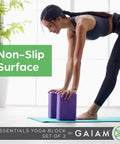 Kick Your Practice Up With This Game Changer Yoga Block Built From Lightweight EVA Foam With A Nonslip Grip And Rounded Beveled Edges That Keep You Balanced Through Pilates Vibes, showing two purple EVA yoga blocks on a mat.