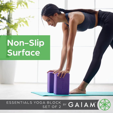 Kick Your Practice Up With This Game Changer Yoga Block Built From Lightweight EVA Foam With A Nonslip Grip And Rounded Beveled Edges That Keep You Balanced Through Pilates Vibes, showing two purple EVA yoga blocks on a mat.