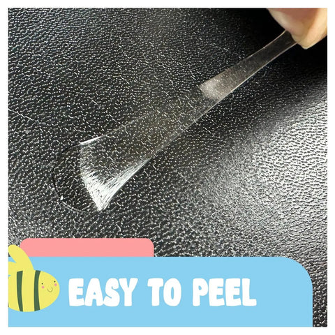 Close-up of Pro Grade Double Sided Painter Tape being peeled off a black surface, showing easy removal capability.