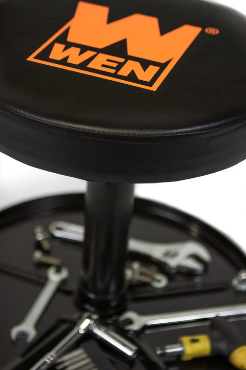 Rolling Mechanic Stool With 300 Pound Capacity Pneumatic Height Adjustment From 15 To 20 Inches Five Two Point Five Inch Swiveling Casters Onboard Tool Storage Heavy Duty Thick Vinyl Padding For All Day Comfort In The Garage Or Workshop displayed with tools on tray