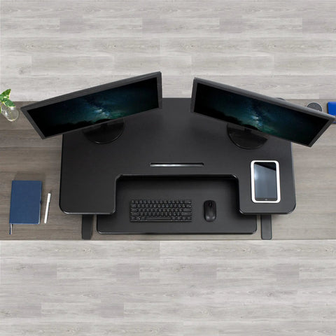 Top view of Electric Height Adjustable Desk Converter With Sit To Stand Function And Dual Monitor Riser 42 Inch Workstation Stand Up Desk with keyboard and tablet