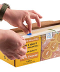 Hands using the cutter on 11 inch by 100 foot vacuum sealer bags rolls with dispenser cutter, BPA free 4 mil thick, in a box.