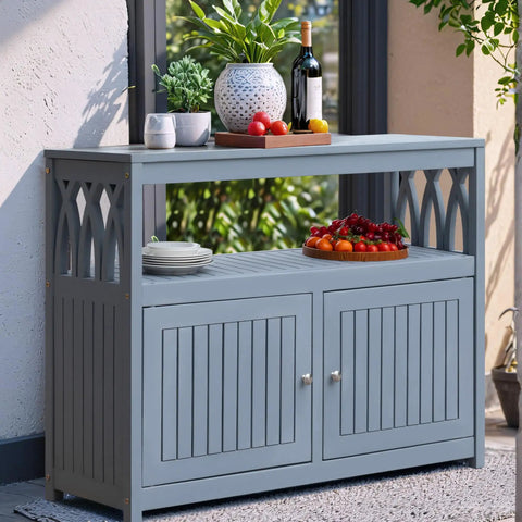 All in One Acacia Wood Outdoor Storage Cabinet With Two Magnetic Doors Weatherproof in gray on patio with decor