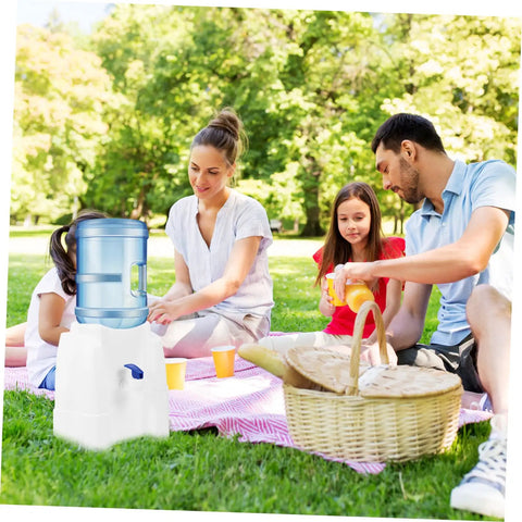 Family using Tabletop Water Dispenser Cooler For Home Office And Outdoor Use during a picnic