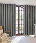 Pack Of 4 Blackout Curtain Panels 37x84 Inches Charcoal Grey Lightweight Thermal Insulated Grommet Drapes For Your Bedroom And Living Room Light Blocking Window Treatment Easy Hang shown installed on window in living room.
