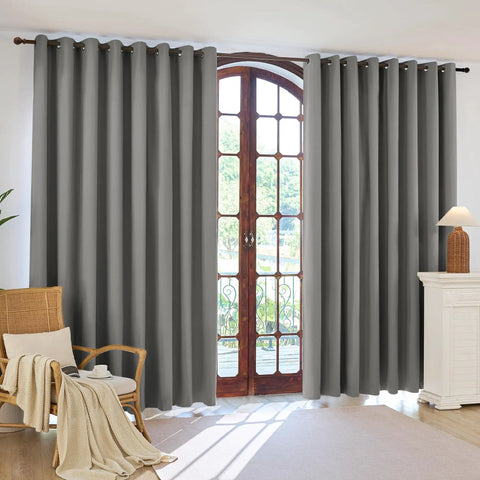 Pack Of 4 Blackout Curtain Panels 37x84 Inches Charcoal Grey Lightweight Thermal Insulated Grommet Drapes For Your Bedroom And Living Room Light Blocking Window Treatment Easy Hang shown installed on window in living room.