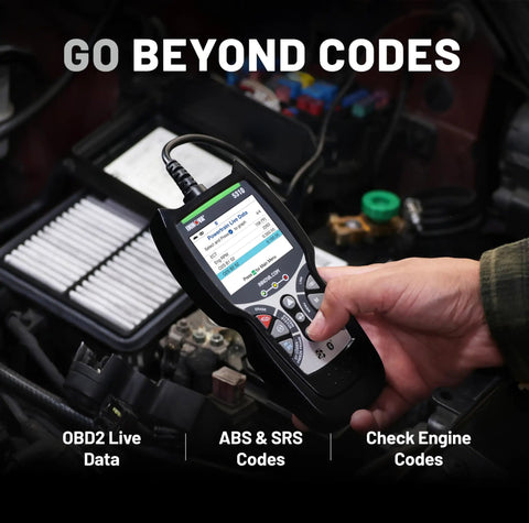 Hand using OBD2 Scanner For ABS And SRS Codes, Check Engine Light Diagnostic Tool With Battery Test, in a car engine bay