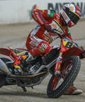 Dirt bike with 130/80-19 FT30 tire racing on flat track, showcasing traction on hard pack and loose surfaces, front wheel use.