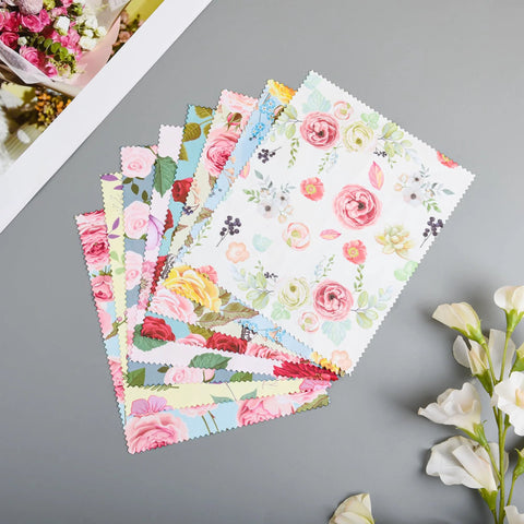 Front view of eight floral microfiber cleaning cloths, 7x6 inches, pastel multicolor patterns.