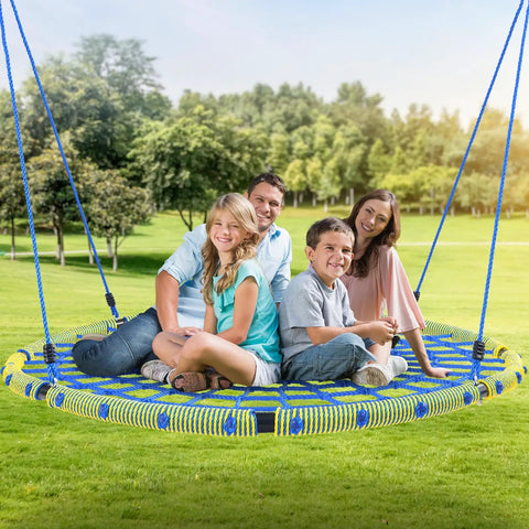 Family enjoying a 60 Inch Spider Web Saucer Tree Swing for Kids and Adults Heavy Duty Outdoor Net Swing in park setting.