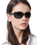 Woman wearing Dope Jackie Ohh Butterfly Sunglasses For Women, Black Frames With Polarized Light Grey Gradient Lenses, 58mm, Medium Fit
