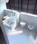 Modern bathroom with Starck 3 toilet seat white high gloss with soft close lid and stainless steel hinges tool free removal.