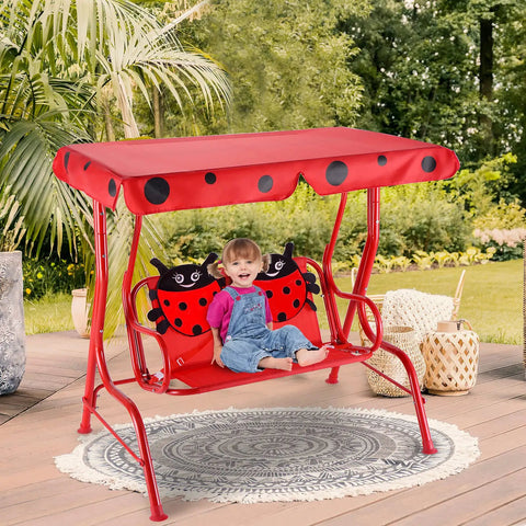 Child sitting on Porch Swing For Two Children With Adjustable Canopy And Safety Belts For All Weather Outdoor Patio Hammock Bench In Red Ladybug Pattern