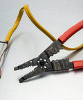 8 Inch Heavy Duty Wire Stripper Cutter Pliers With Dipped Cushioned Grips on wires, demonstrating effectiveness in stripping 10 to 22 AWG
