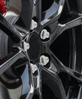 Five Piece Silver Steel Car Wheel Lug Nuts Set For Universal Tire And Rim Replacement Premium Rust Resistant Finish Bulletproof Hold No Drama Swap For Daily Drivers on glossy black alloy wheel.