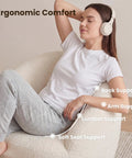 Woman relaxing in a White Boucle Swivel Chair With 360 Degree Base, Oversized Round Barrel Accent Chair For Living Room, highlighted supports.