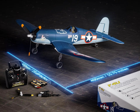 Brushless RC Plane With 4 Channel Remote Control Aerobatic 2.4 GHz Aircraft With 6 Axis Gyro Stabilizer And 3 Flight Modes, Blue F4U Corsair Edition displayed with remote control and accessories.