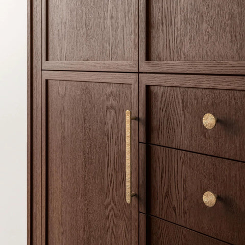 Champagne Bronze Cabinet Knobs Set 1.1 Inch Diameter Zinc Alloy Drawer Pulls installed on brown wooden cabinets.