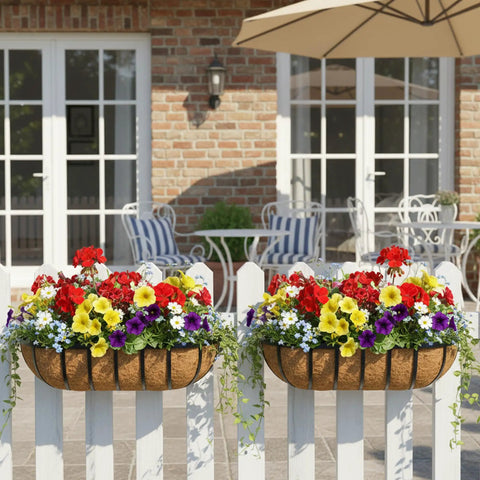 Front view of 36 Inch Railing Planter Window Box For Deck And Balcony With Coco Liner And Metal Wall Mount Two Pack Outdoor Flower Troughs filled with flowers on a fence.