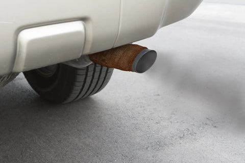 Car exhaust pipe wrapped with Heat Wrap That Hardens Like Steel For Exhaust Pipes And High Temp Repairs 2 Inch Roll Durable Fix.