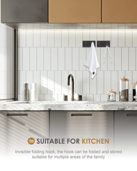 Two Pack Waterproof Matte Black Towel Hooks in kitchen holding towel, mounted on wall above counter, modern space-saving design