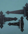 Hella Heavy Duty Black Strap Hinges For Shed Barn Doors And Wooden Fences Top Shelf Gate Hardware With Mounting Screws showing three black strap hinges on a green background.
