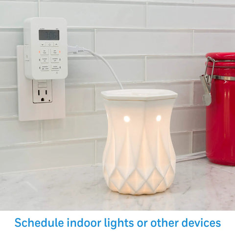 Plug In Digital Timer With Two Grounded Outlets And Seven Day Programming controlling a lamp on a kitchen countertop.
