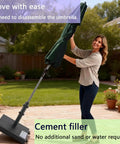 Woman adjusting umbrella with 45lbs Beefy Heavy Duty Outdoor Umbrella Base For 1.2 To 2.2 Inch Poles on patio