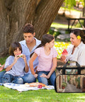 Family enjoying a picnic with Insulated Picnic Backpack Tote Bag 30L Large Capacity Italy Street Cooler Bag in a park setting