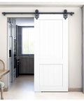 Ornate Black Iron Sliding Barn Door Hardware Kit For Single Door With 5.5 Foot Track installed in kitchen entrance