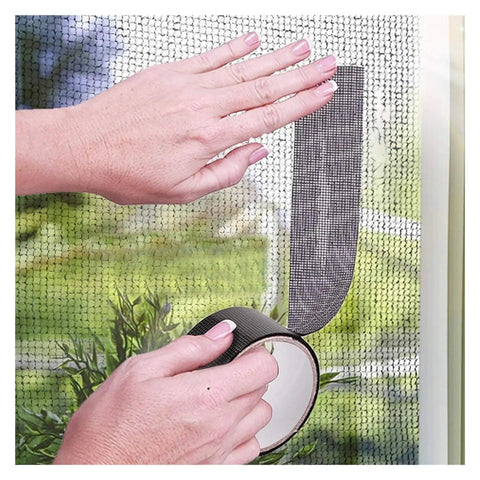 Applying self adhesive window screen repair tape 5x200cm mesh patch for windows and doors quick fix no hassle strong adhesive