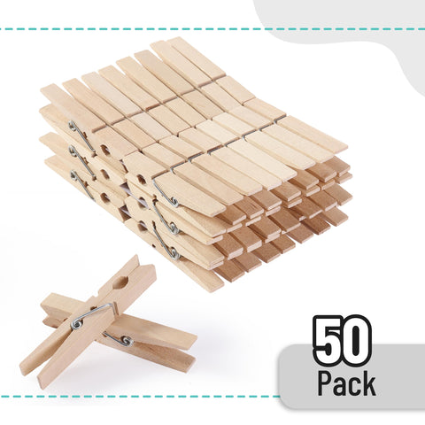 Large Wooden Clothes Pins 2.9 Inch 50 Pack Built Tough Galvanized Coil Springs Top Shelf stacked in a pile with one pin upright.