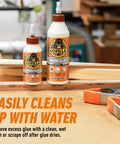 Two bottles of wood glue in a workshop setting, labeled Wood Glue 8 Ounce Bottle Natural Wood Color Indoor and Outdoor Water Resistant Bond