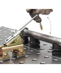 Grasshopper Magnetic Welding Finger With Brass Tip And Spring Loaded Arm Adjustable Length Anti Tipping Bolt 35 lb Magnetic Pull V Pad Base Ideal For Tack Welds Small Parts Like Nuts Bolts Thin Plates AGH230 in use on a welding bench.