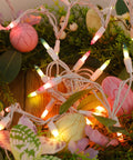Close-up of Two Pack Easter Fairy Lights Set With 100 Mini Pastel Bulbs On 20 Ft White Wire Multicolor 120V UL Certified, in wreath.