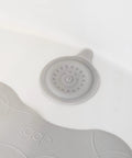 Close-up of Premium Soft Silicone Bathtub Drain Stopper with Super Strong Suction Cup in a white tub, measuring five inches across.