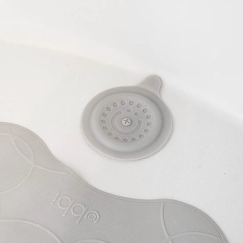 Close-up of Premium Soft Silicone Bathtub Drain Stopper with Super Strong Suction Cup in a white tub, measuring five inches across.