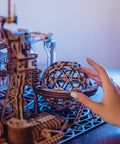 Close-up of Electric Motorized Wooden Marble Run Kit For Adults A Dope 3D Puzzle That You Build Yourself being assembled.