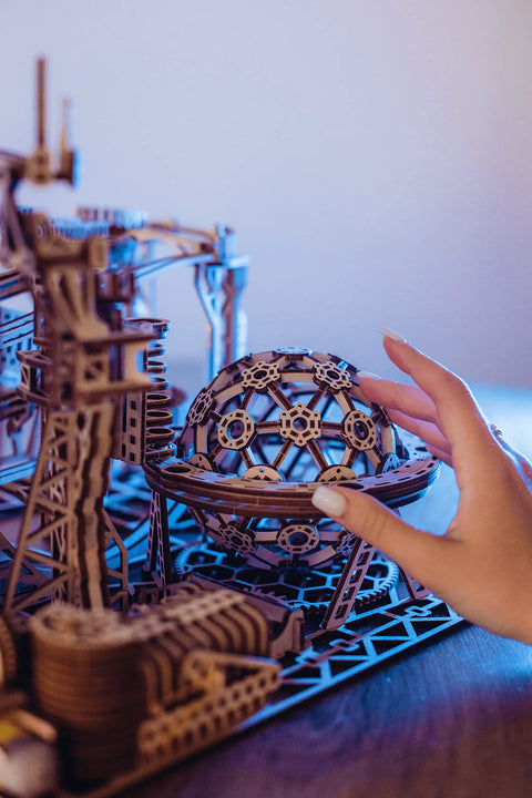 Close-up of Electric Motorized Wooden Marble Run Kit For Adults A Dope 3D Puzzle That You Build Yourself being assembled.