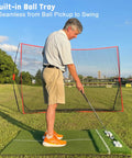Man practicing on Oversized 6x4ft Golf Hitting Mat With Built In Ball Tray Dual Turf for Indoor and Outdoor Practice Works With Golf Simulators