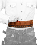 Person wearing rugged cowhide leather shotgun shell bandolier belt for 12 gauge and 16 gauge ammo built tough with handbraid detailing.