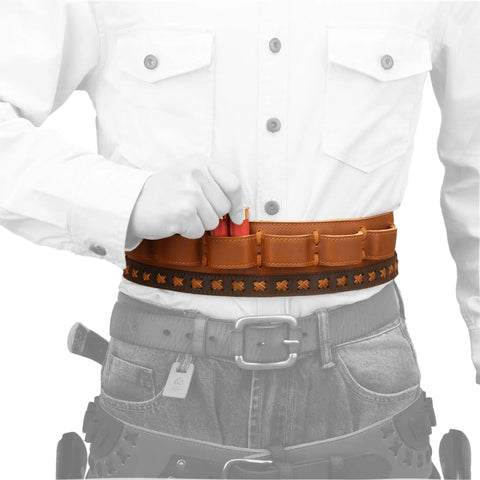 Person wearing rugged cowhide leather shotgun shell bandolier belt for 12 gauge and 16 gauge ammo built tough with handbraid detailing.