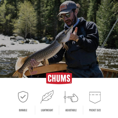Man fishing with Travel Hat Clip With Adjustable Cap Retainer near river, showcasing durability and versatility.