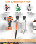 Heavy Duty Magnetic Hooks Set Of 3 For Garage And Workshop Industrial Grade Hangers To Hold Hammer Tools Drills Garden Hose And More Rubber Coated To Prevent Scratches On Surfaces For Indoor Or Outdoor Use holding various tools on a pegboard.
