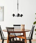 Farmhouse Chandelier Three Head LED Light Fixture In Black Matte Finish hangs over dining room table with chairs