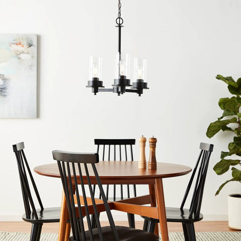 Farmhouse Chandelier Three Head LED Light Fixture In Black Matte Finish hangs over dining room table with chairs
