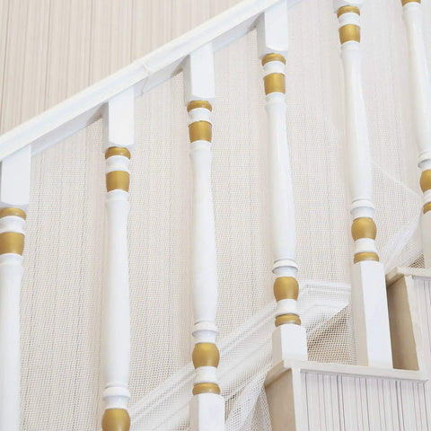 Kid Safe Banister Guard Net For Baby And Pets 15ft Long 3ft High Rail Balcony Stair Mesh installed on white stair railing